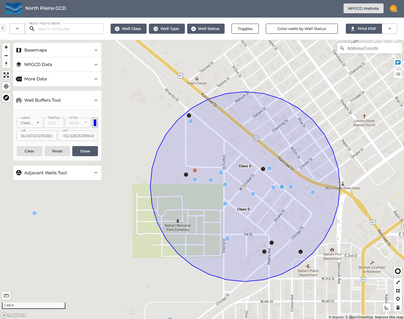 Well Buffers Map Tool - an interactive GIS map for spacing/buffer analysis. A left toolbox offers Basemaps, NPGCD Data and More Data layer toggles, a Well Buffers Tool (pick a well Class, set a radius and/or enter Lat/Lng, then Draw, with Clear/Reset) and an Adjacent Wells Tool. The map renders well points colored by status with class labels and draws a circular buffer of the chosen radius around a location to evaluate nearby/adjacent wells. Top controls filter by Well Class, Well Type and Well Status, toggle 'Color wells by Well Status', and Print to PDF. Demonstrates draw/select and spatial-buffer tools for well-spacing and proximity analysis.
